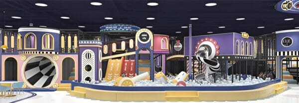 A colorful arcade-style claw machine filled with large food items and desserts.