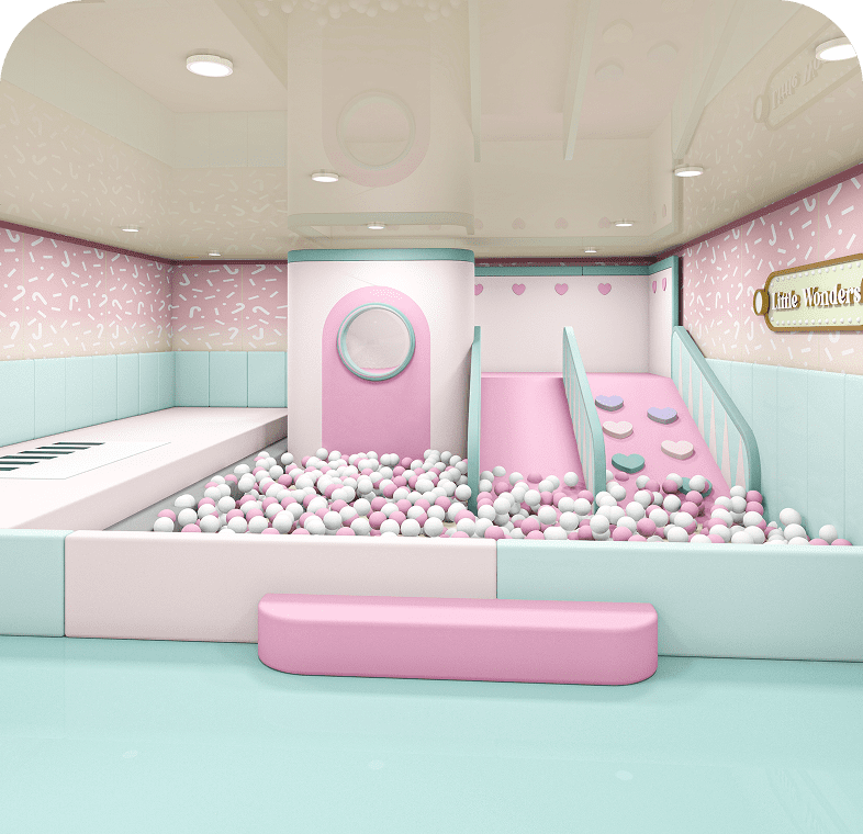 A pastel-themed indoor ball pit with slides and playful design.