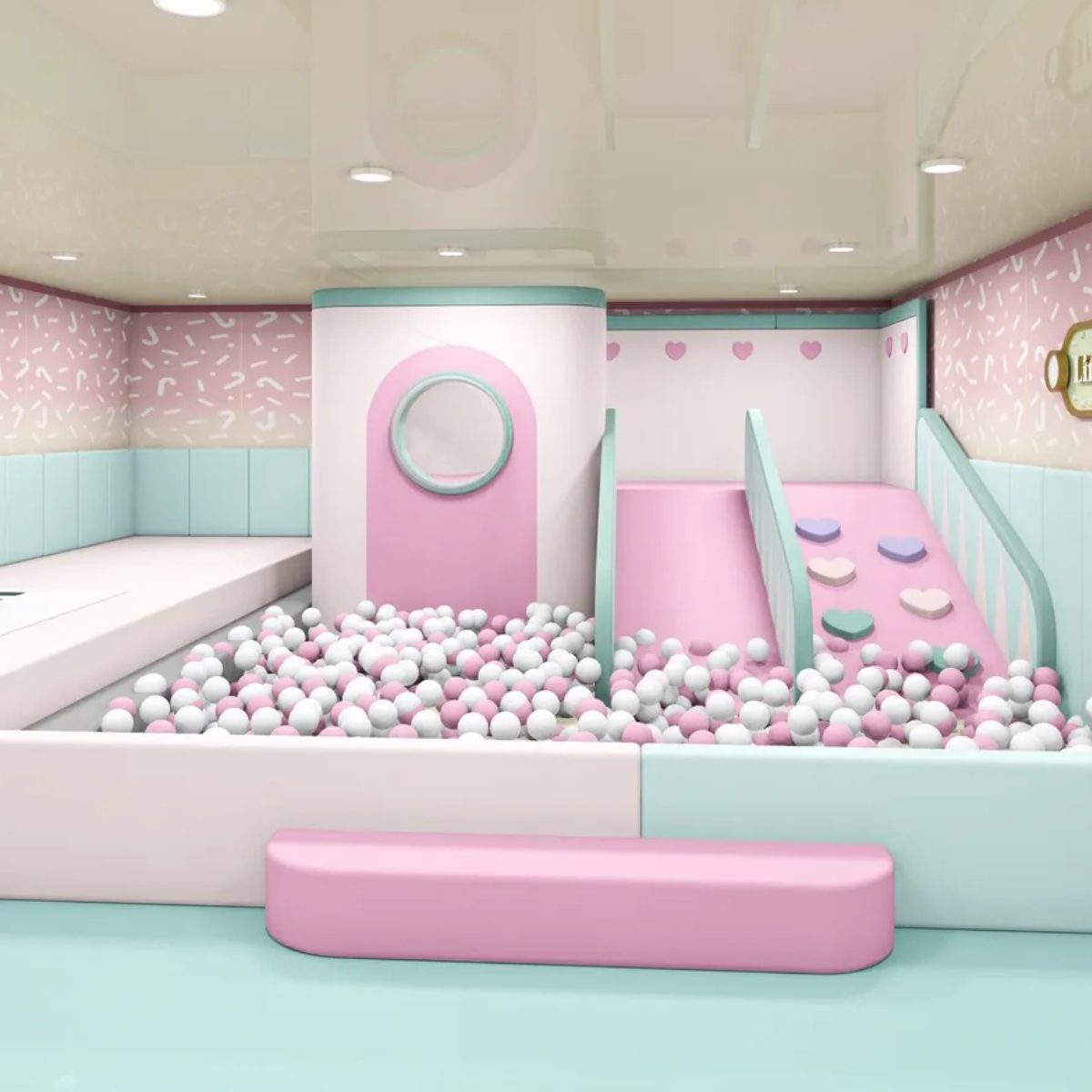 A pastel-colored indoor play area with slides and a ball pit.